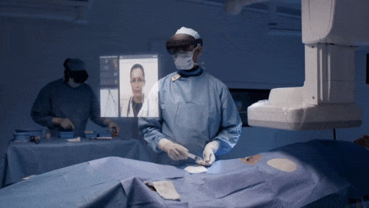 A doctor performs surgery using Microsoft Hololens 2 and Remote Assist to video with a specialists 