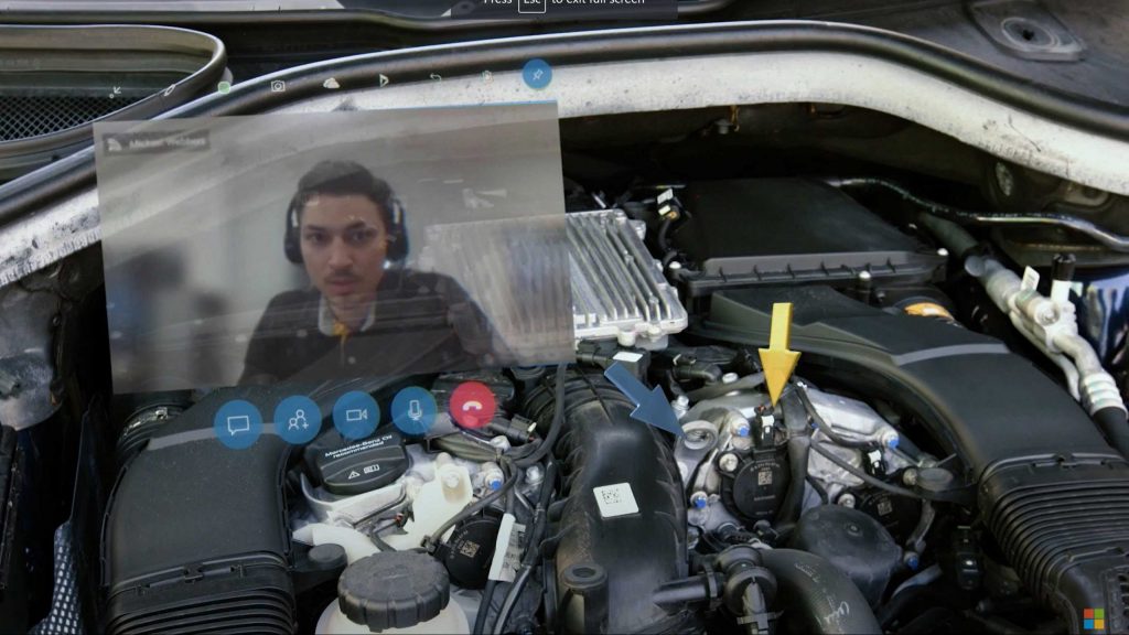 Mercedes-Benz specialist guiding a service technician via remote assist video call how to fix a car enngine 