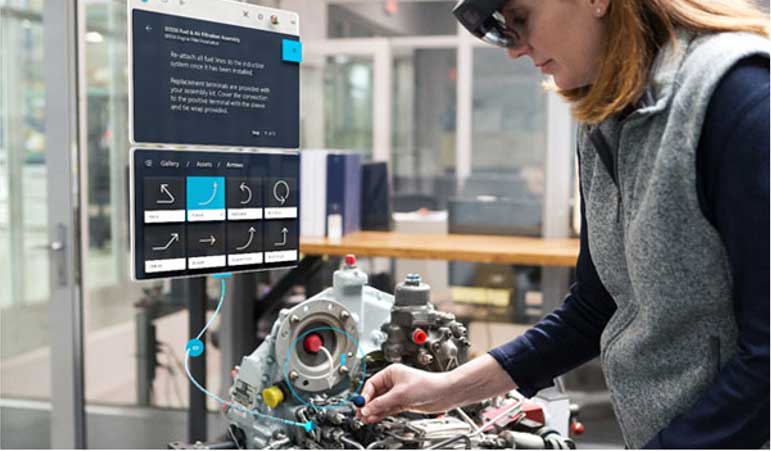 Employee building a car egine using Microsoft Hololens 2 and Dynamics 365 Guides